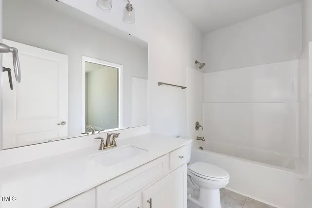 a bathroom with a sink a toilet and a bathtub