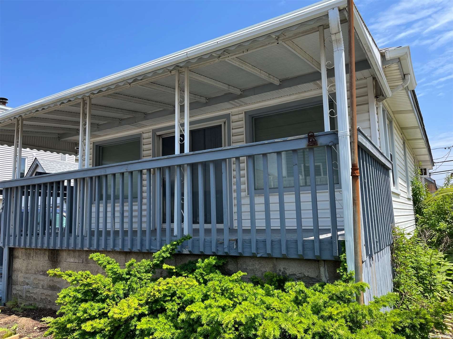 a view of a house with wooden fence