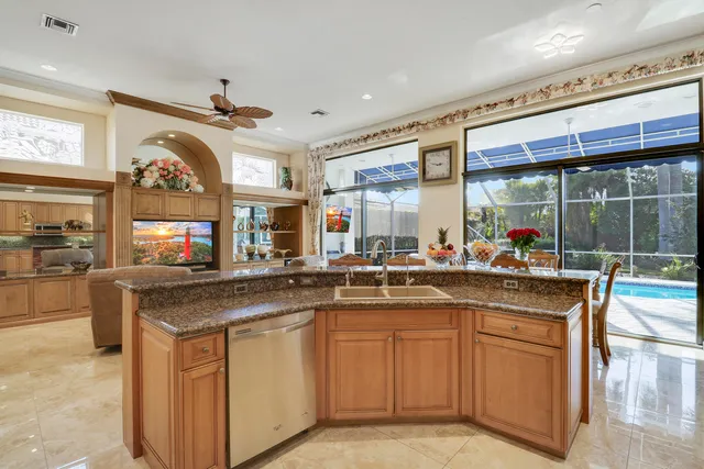 a aerial view of a house with a yard basket ball court and outdoor seating