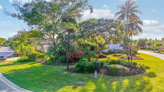 a view of a swimming pool and lounge chairs