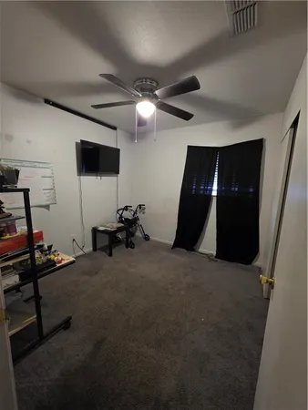 a bed room with a bed and a flat screen tv