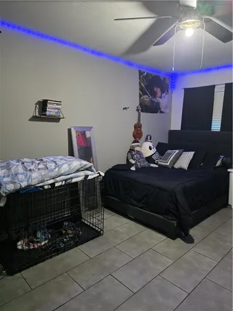 a bedroom with a bed and a fireplace