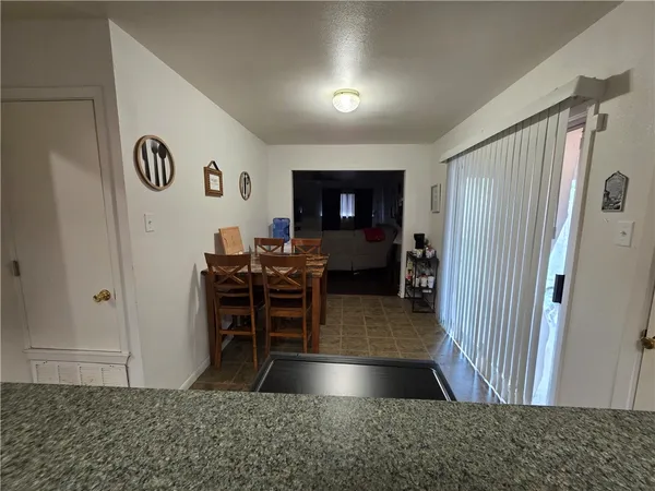 a view of a livingroom with furniture and front door