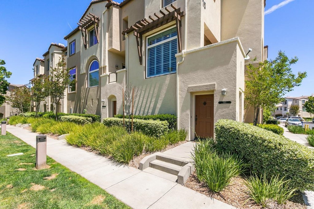 585 Almond Road San Marcos, CA 92078 - Photo 1 of 1 a front view of a house with a yard