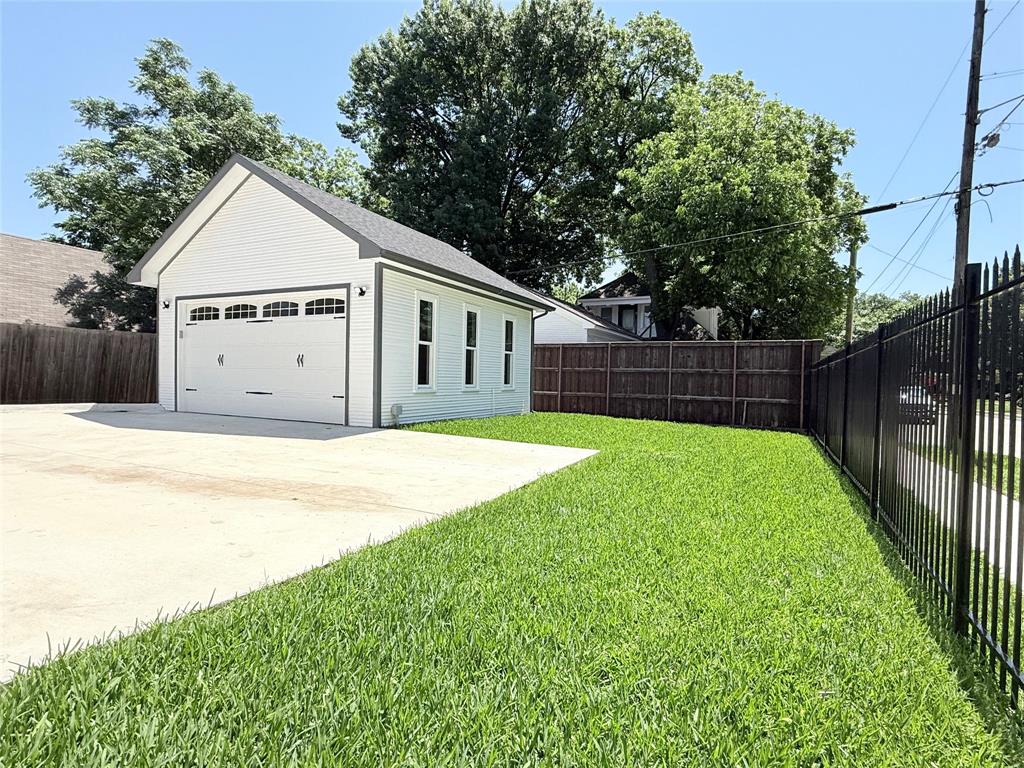 4602 Sycamore Street Dallas, TX 75204 - Photo 21 of 24 a view of a house with a yard and a garden
