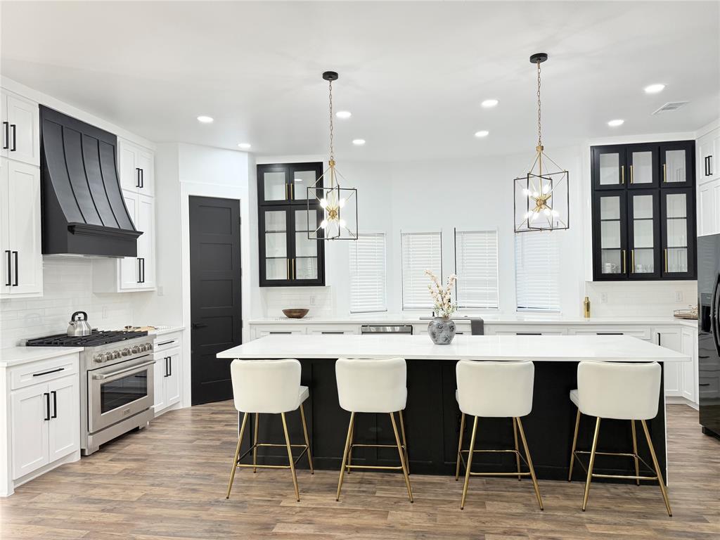 4602 Sycamore Street Dallas, TX 75204 - Photo 3 of 24 a large kitchen with a table and chairs