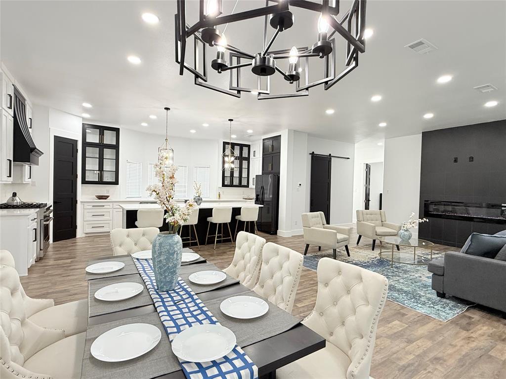 4602 Sycamore Street Dallas, TX 75204 - Photo 9 of 24 a living room with furniture kitchen view and a chandelier