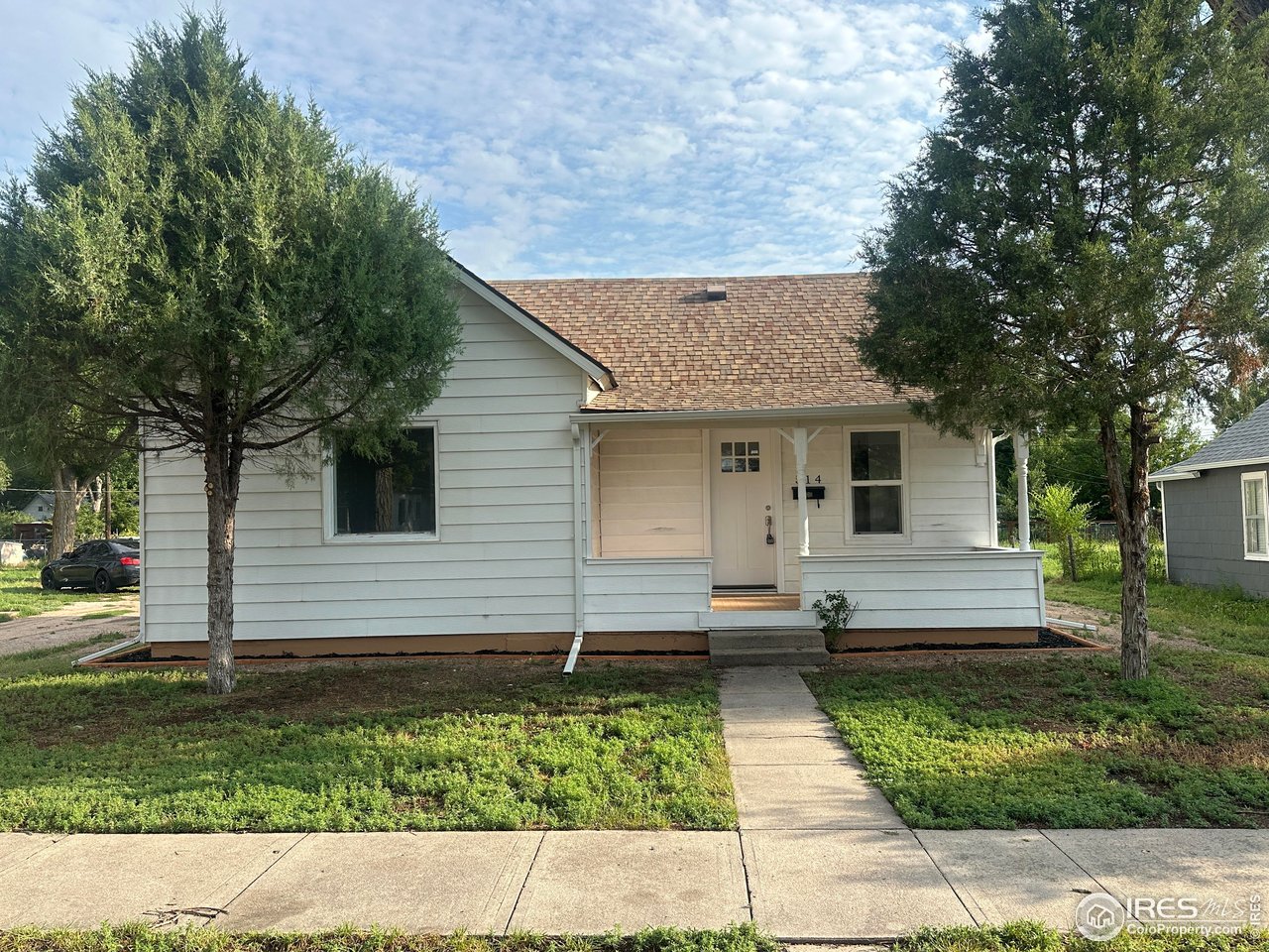 514 Hamilton Street Sterling, CO 80751 - Photo 1 of 12 Front of Home with Covered Porch