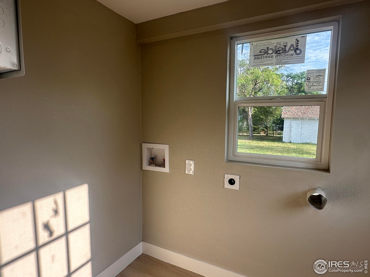 514 Hamilton Street Sterling, CO 80751 - Photo 10 of 12 Laundry with plenty of room for storage