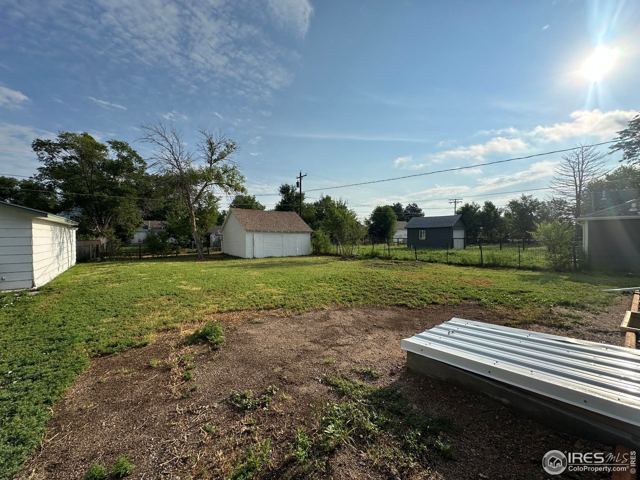 514 Hamilton Street Sterling, CO 80751 - Photo 11 of 12 Backyard and oversized Storage unit