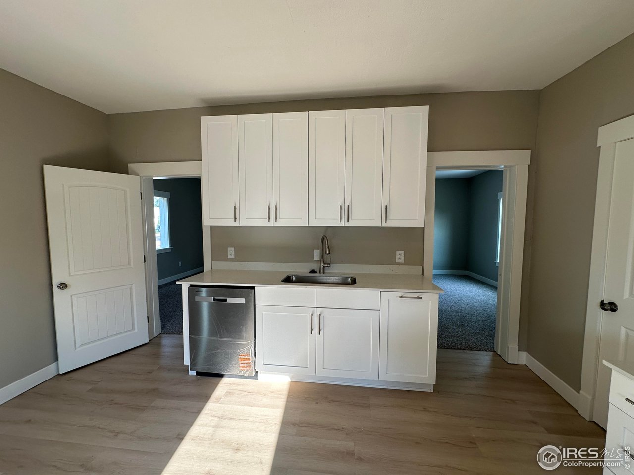 514 Hamilton Street Sterling, CO 80751 - Photo 3 of 12 Kitchen with Quartz counters and Stainless appliances.