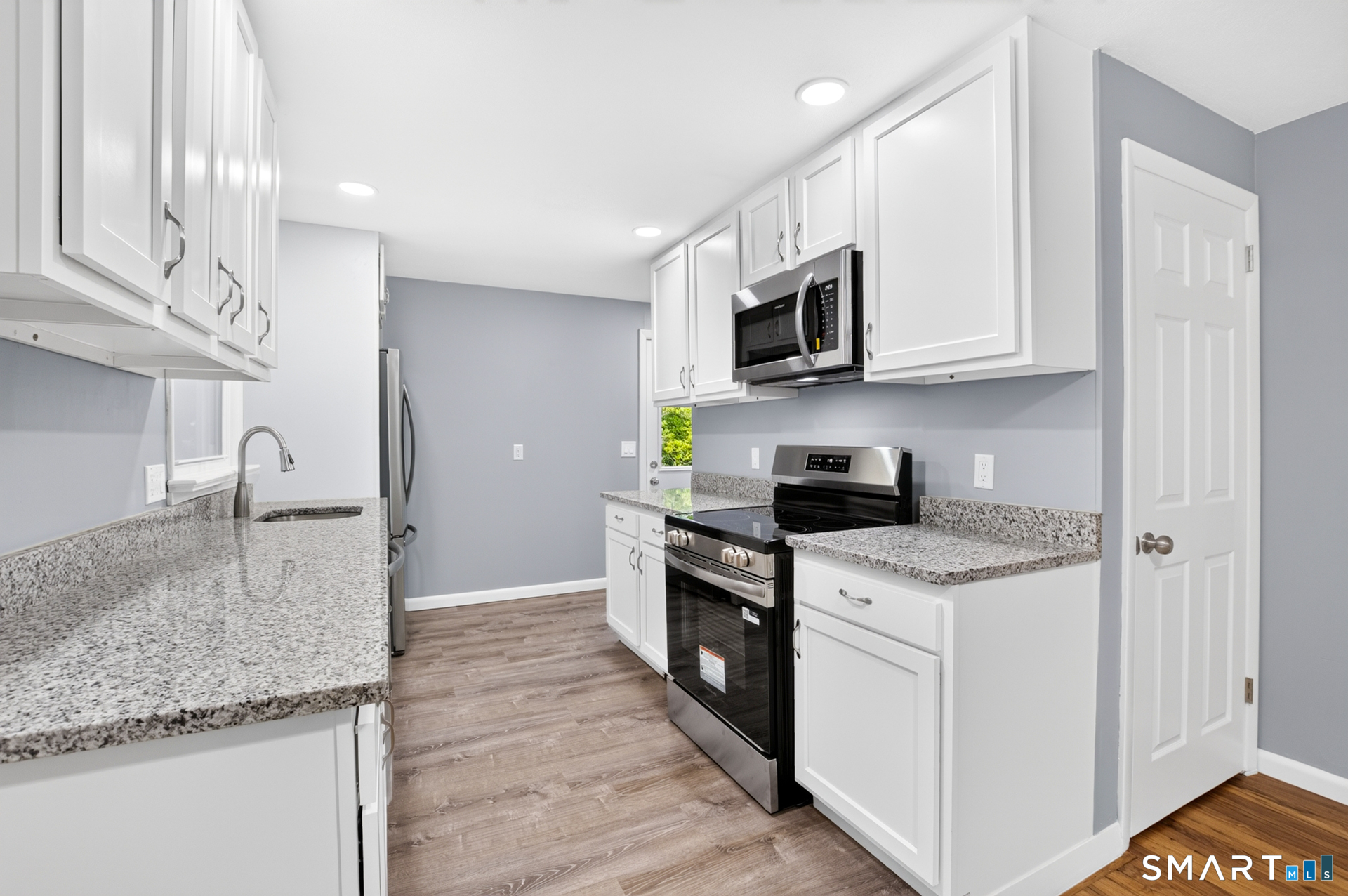 51 Beechwood Road Montville, CT 06370 - Photo 6 of 27 White Cabinetry, Stainless Steel Appliances & Updated Finishes