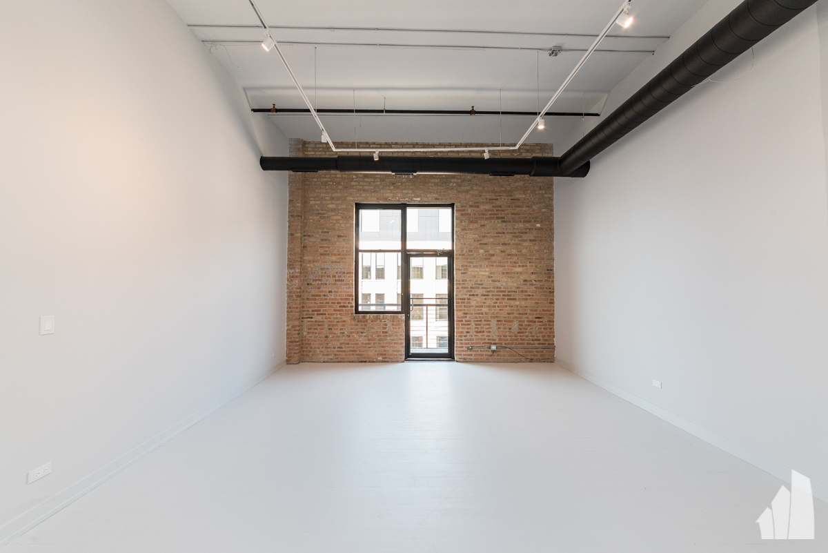 213 North Racine Avenue, Unit 305 Chicago, IL 60607 - Photo 12 of 22 a view of a hallway with a window