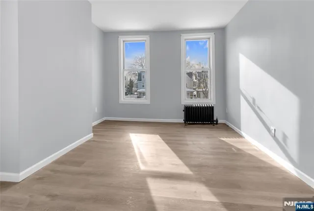 a view of an empty room with windows