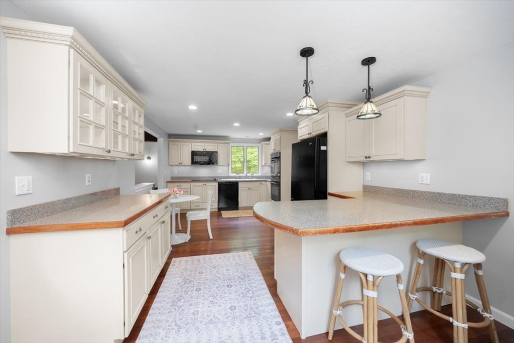 48 Knollwood Road Norwell, MA 02061 - Photo 13 of 41 a kitchen with a table a sink and cabinets