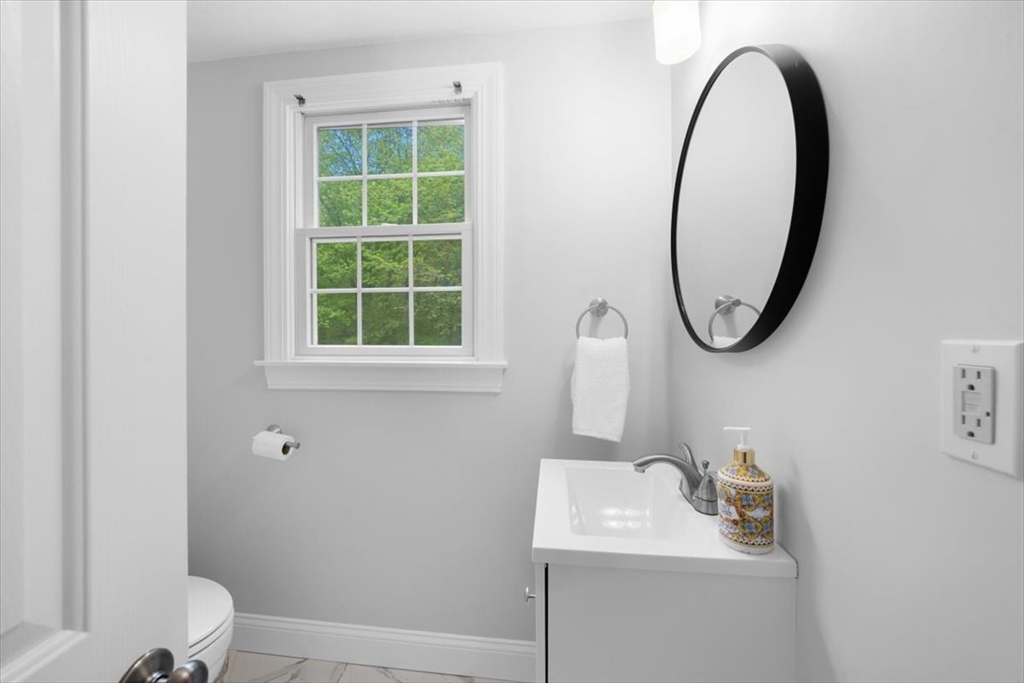 48 Knollwood Road Norwell, MA 02061 - Photo 15 of 41 a bathroom with a sink a toilet and a mirror