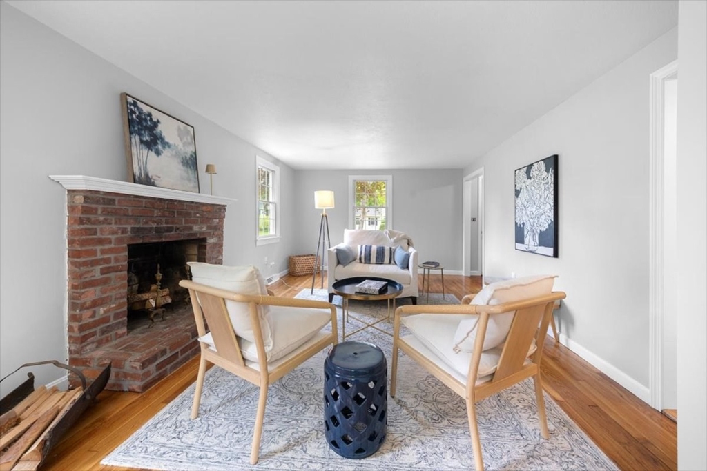 48 Knollwood Road Norwell, MA 02061 - Photo 17 of 41 a living room with furniture and a fireplace
