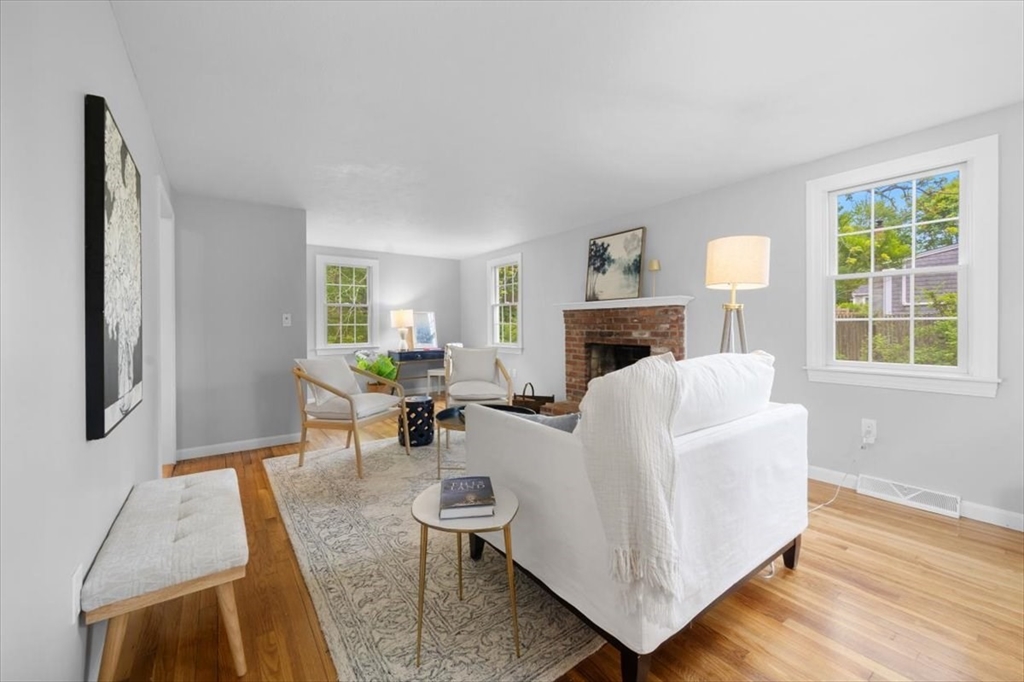 48 Knollwood Road Norwell, MA 02061 - Photo 18 of 41 a living room with furniture a fireplace and a large window