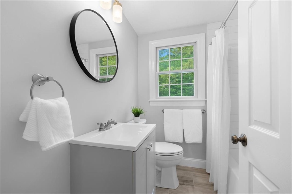 48 Knollwood Road Norwell, MA 02061 - Photo 20 of 41 a bathroom with a sink and a mirror