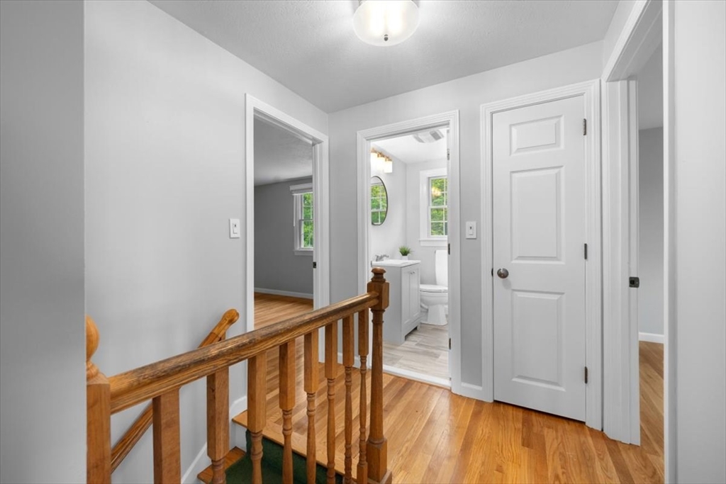 48 Knollwood Road Norwell, MA 02061 - Photo 24 of 41 a view of a hallway with wooden floor and staircase