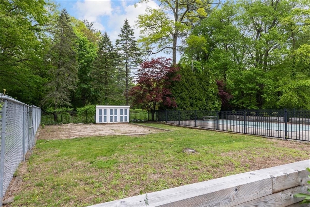 48 Knollwood Road Norwell, MA 02061 - Photo 32 of 41 a view of a backyard with a small pool