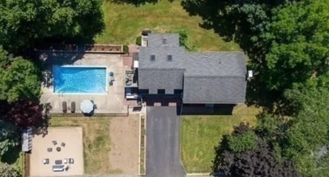 48 Knollwood Road Norwell, MA 02061 - Photo 34 of 41 an aerial view of a house with swimming pool and large trees