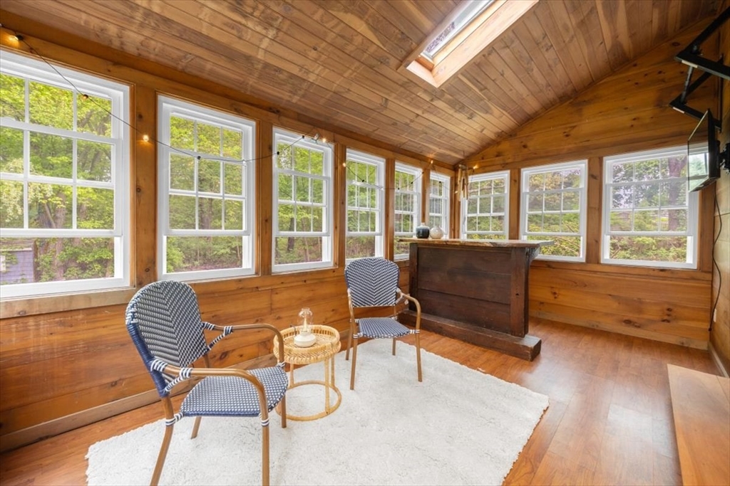 48 Knollwood Road Norwell, MA 02061 - Photo 9 of 41 a living room with furniture and floor to ceiling windows