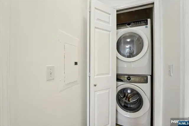 a view of a hallway with washer and dryer