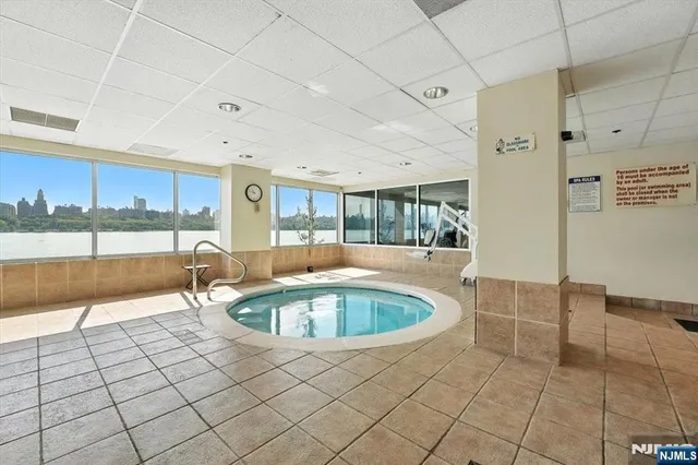 a living room with a large window and a table