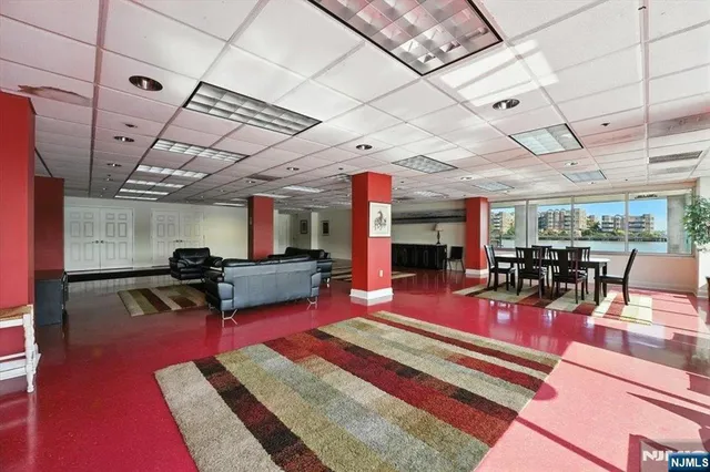 a sitting area with lots of gym equipment