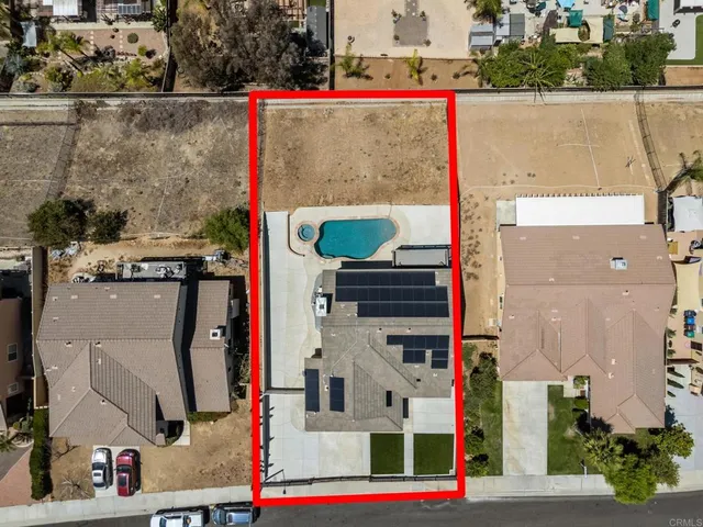 a view of hallway with stairs and wooden floor