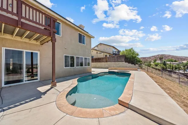a kitchen with stainless steel appliances granite countertop a stove and a refrigerator