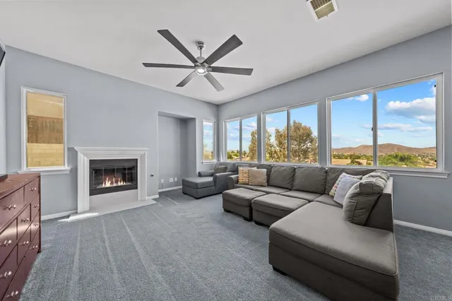 a bedroom with a bed couch and window