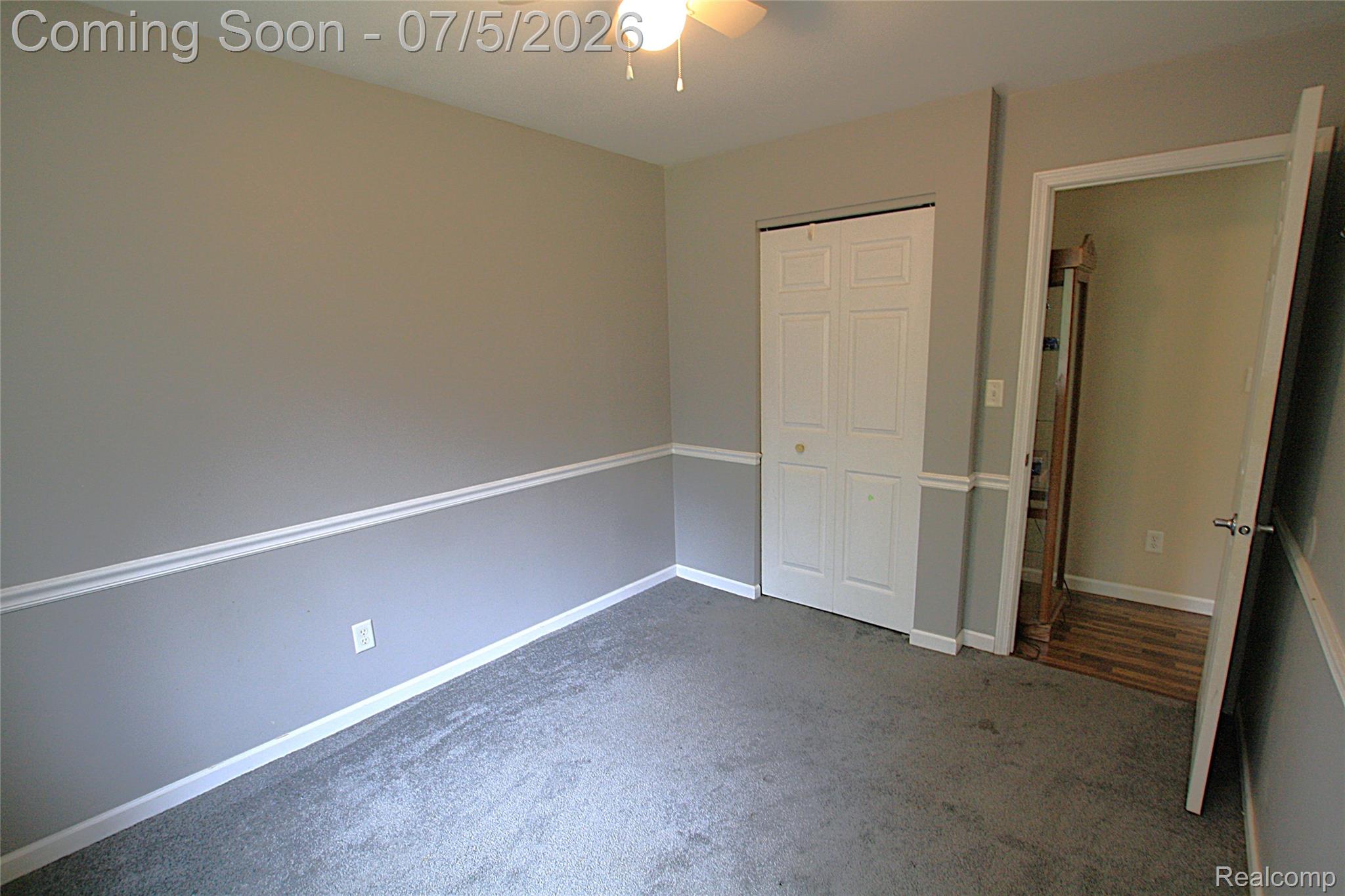 12403 Willard Road Montrose, MI 48457 - Photo 22 of 30 Unfurnished bedroom with carpet flooring, a closet, and ceiling fan