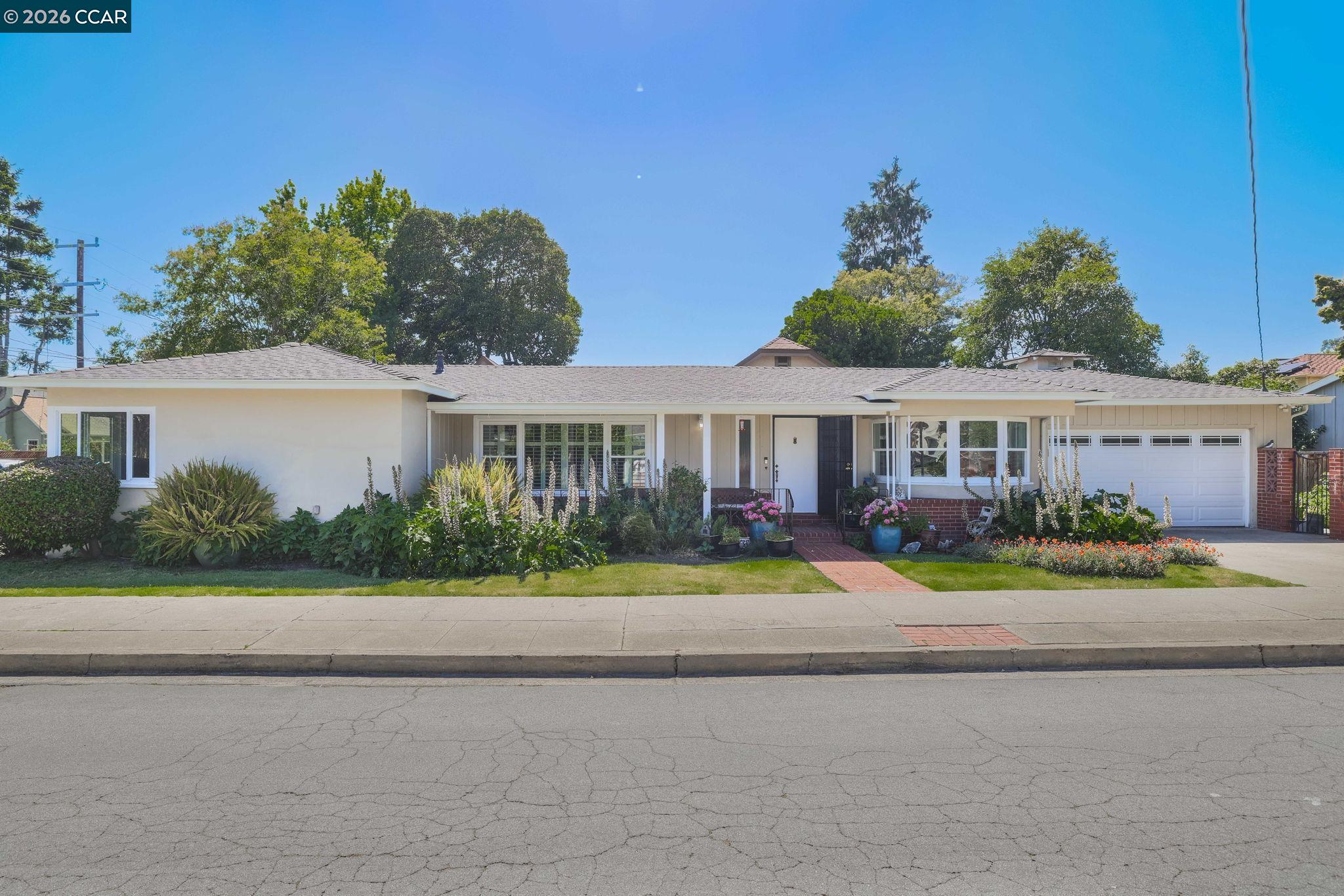 1051 San Rafael Street San Leandro, CA 94577 - Photo 2 of 26 front view of a house with a yard