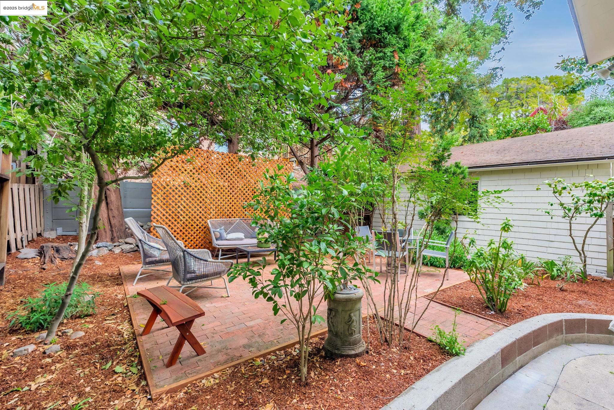 971 Santa Barbara Road Berkeley, CA 94707 - Photo 22 of 37 a view of a backyard with plants and sitting area