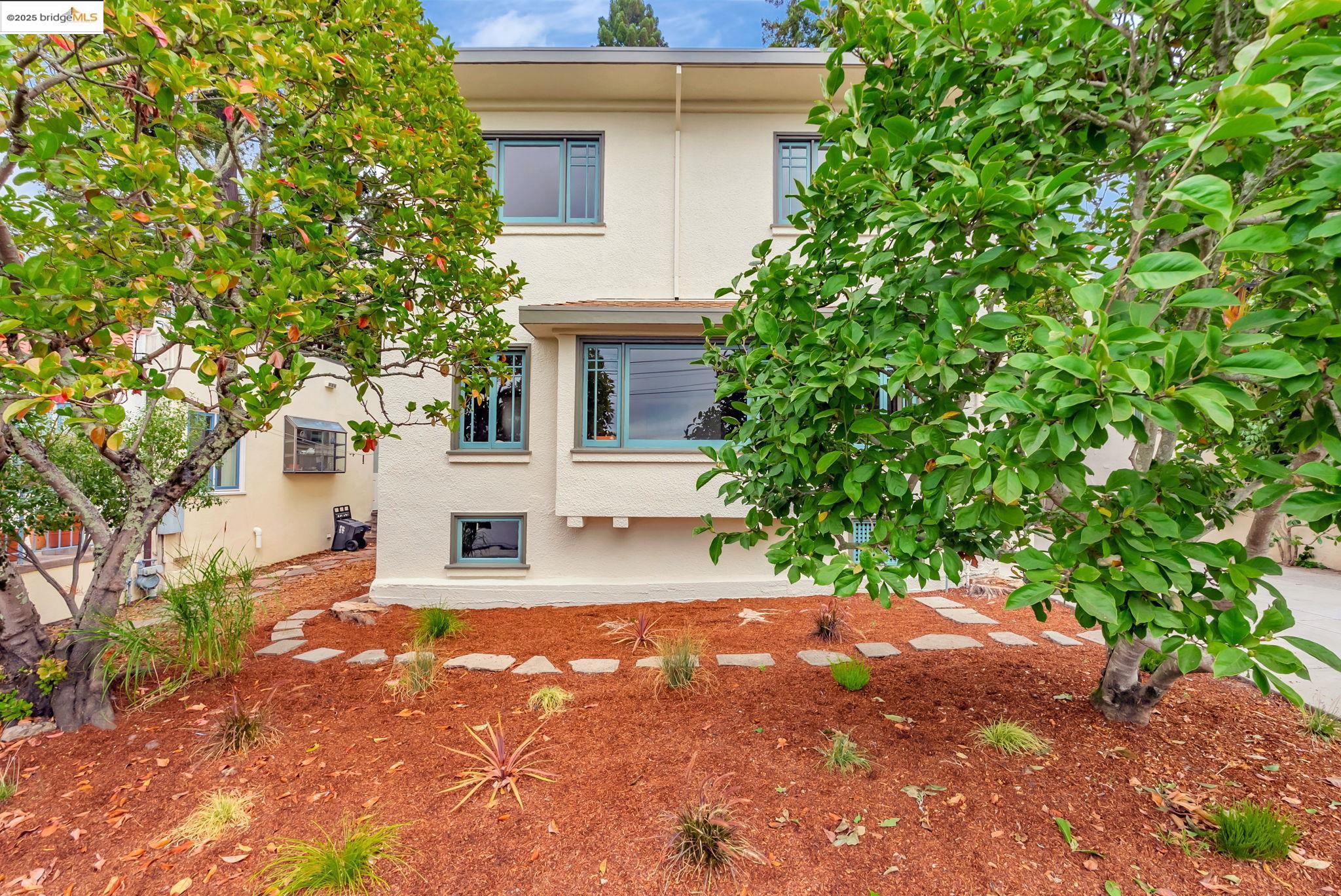 971 Santa Barbara Road Berkeley, CA 94707 - Photo 27 of 37 a view of a house with a yard and tree
