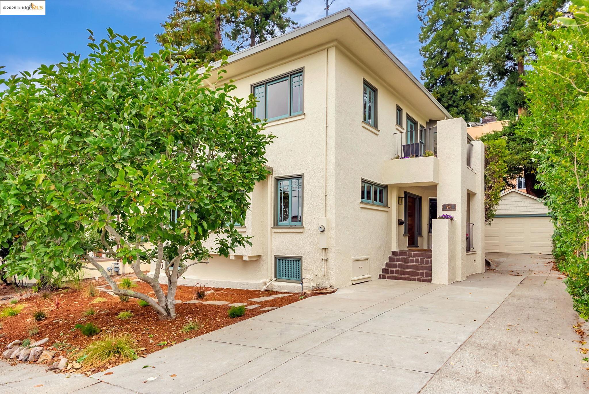 971 Santa Barbara Road Berkeley, CA 94707 - Photo 34 of 37 a front view of a house with a yard and trees