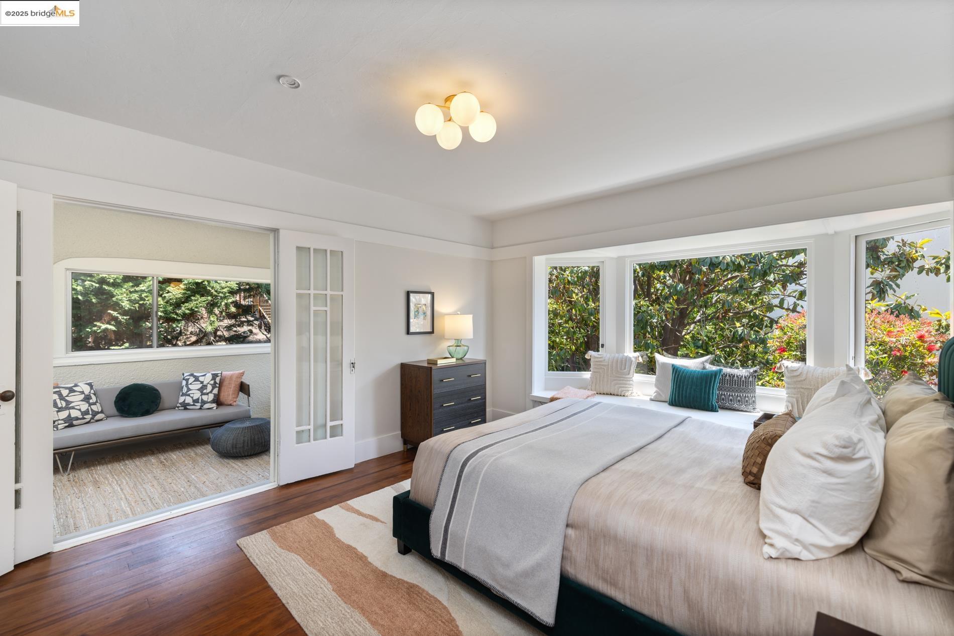 971 Santa Barbara Road Berkeley, CA 94707 - Photo 35 of 37 a bedroom with a bed and a large window with outer view