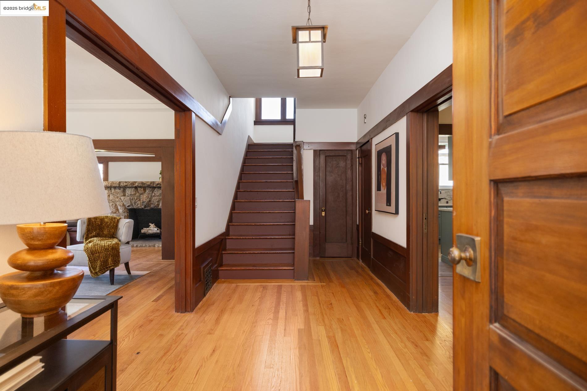 971 Santa Barbara Road Berkeley, CA 94707 - Photo 37 of 37 a view of a hallway with wooden floor and staircase