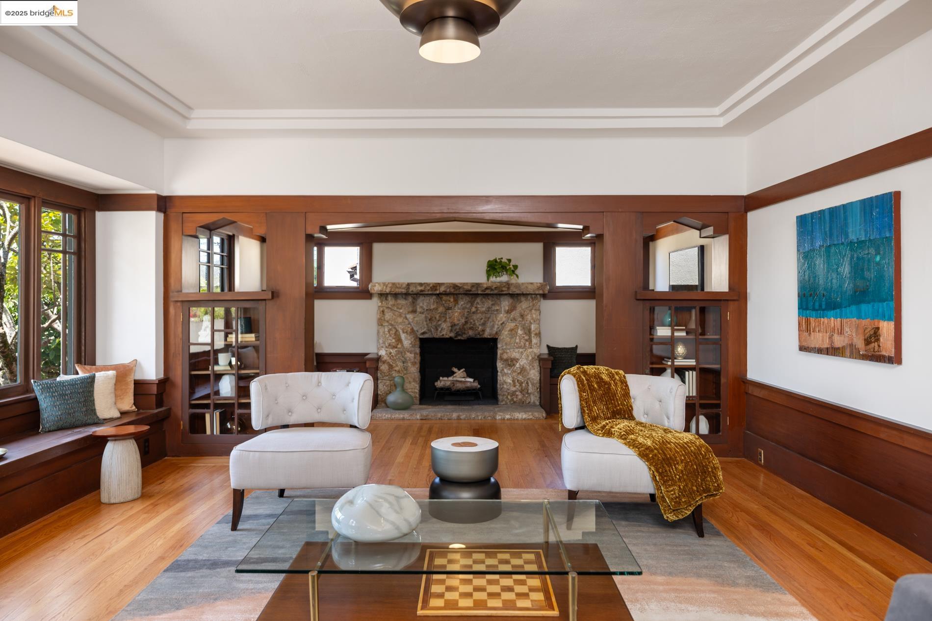 971 Santa Barbara Road Berkeley, CA 94707 - Photo 4 of 37 a living room with furniture and a fireplace