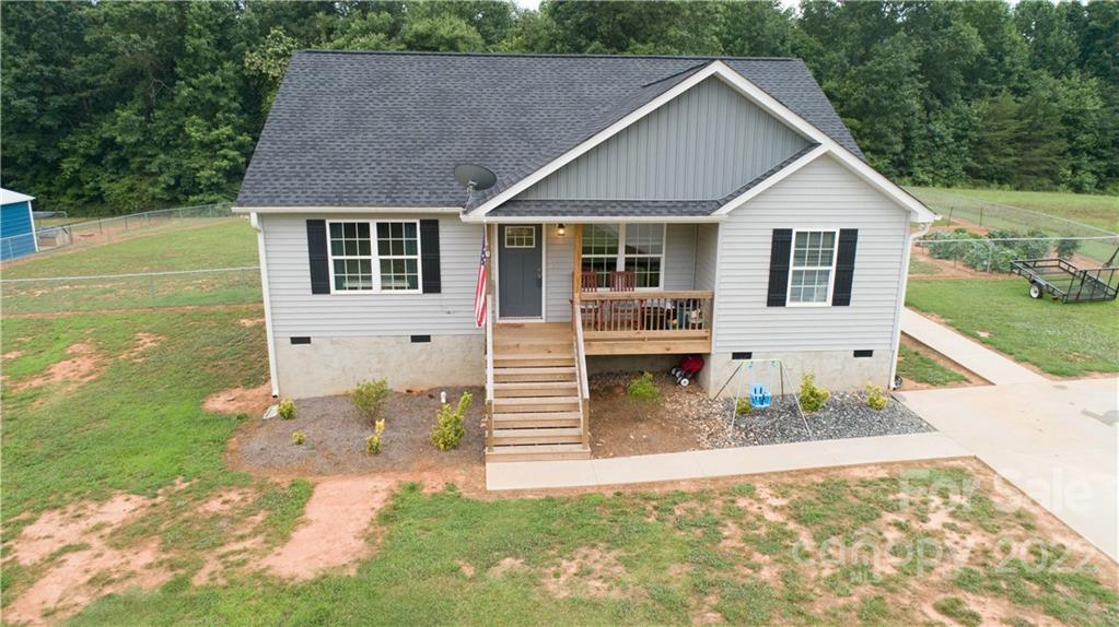 2993 Greenleaf Road Clover, SC 29710 - Photo 1 of 27 a front view of a house with garden