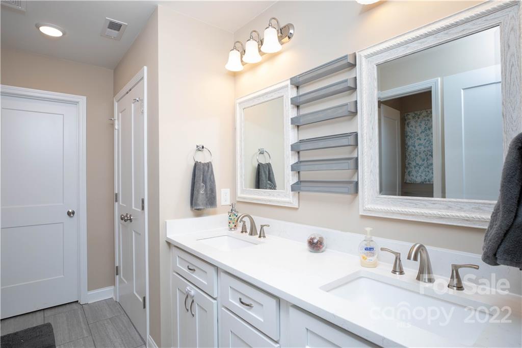 2993 Greenleaf Road Clover, SC 29710 - Photo 12 of 27 a bathroom with a double vanity sink and a mirror