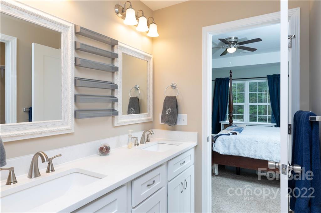 2993 Greenleaf Road Clover, SC 29710 - Photo 13 of 27 a en suite bathroom with a double vanity sink and mirror