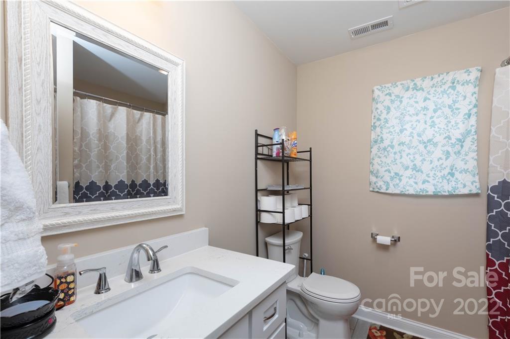 2993 Greenleaf Road Clover, SC 29710 - Photo 15 of 27 a bathroom with a sink toilet and mirror