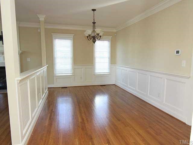1327 Ileagnes Road Raleigh, NC 27603 - Photo 4 of 21 Crown molding, wainscoting, beautiful hdwds, open and bright...what more could you want?