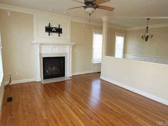 1327 Ileagnes Road Raleigh, NC 27603 - Photo 5 of 21 Neutral colors, beautiful oil-rubbed bronze light fixtures and a marble surround on the fireplace...this place is move-in ready!