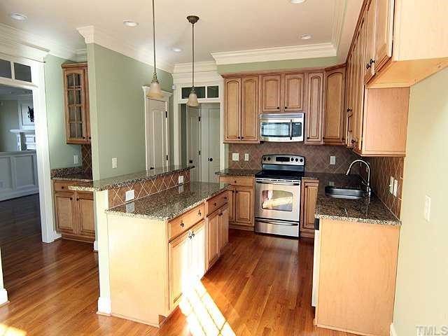1327 Ileagnes Road Raleigh, NC 27603 - Photo 6 of 21 A true chef's kitchen with gorgeous granite, stainless appliances, tile backsplash and cabinets galore.