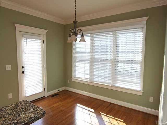 1327 Ileagnes Road Raleigh, NC 27603 - Photo 9 of 21 There is so much natural light in this home. The eat-in kitchen is surrounded by windows.