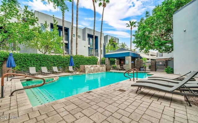 a view of a house with backyard porch and sitting area